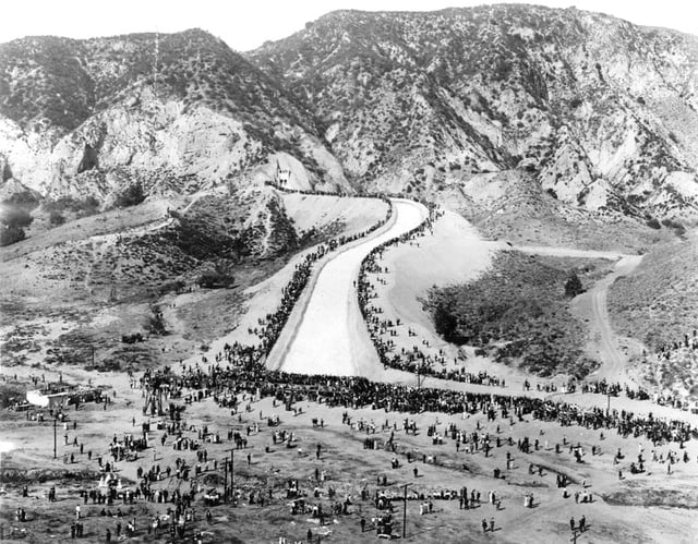 Crowds gather to see the first water reaching the valley via the new aqueduct.
