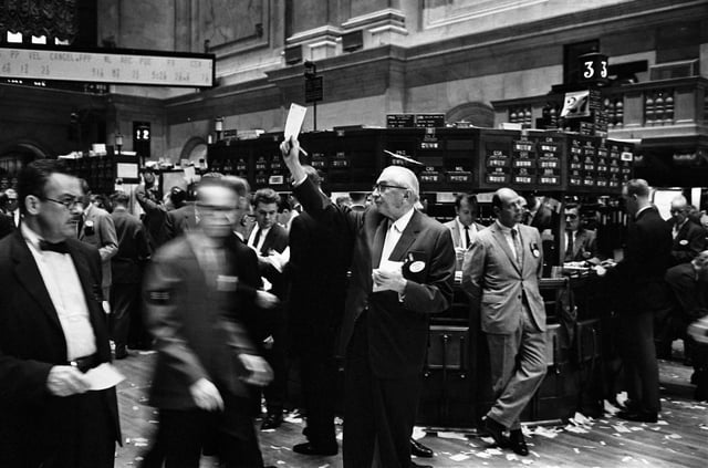 NYSE's stock exchange traders floor before the introduction of electronic readouts and computer screens.