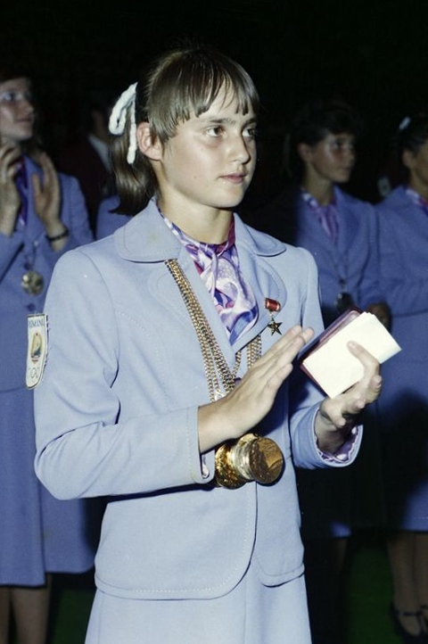 Comăneci wearing her medals