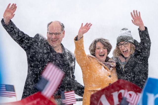 Klobuchar (center) with her husband and daughter at her campaign announcement