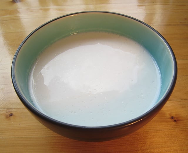 Coconut milk, a widely used ingredient in the cuisines of regions where coconuts are native