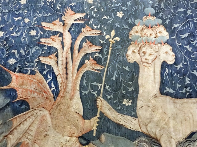 Satan (the Dragon) gives to the Beast of the sea (on the right) power represented by a sceptre in a detail of panel III.40 of the medieval French Apocalypse Tapestry, produced between 1377 and 1382.