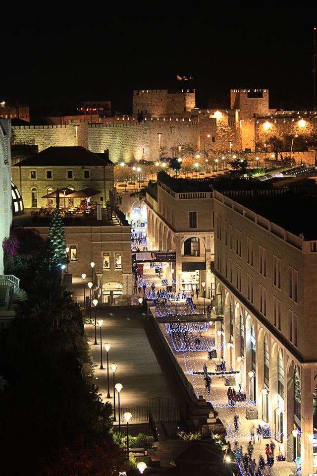 Mamilla Mall adorned with upscale shops adjacent to the Old City Walls.