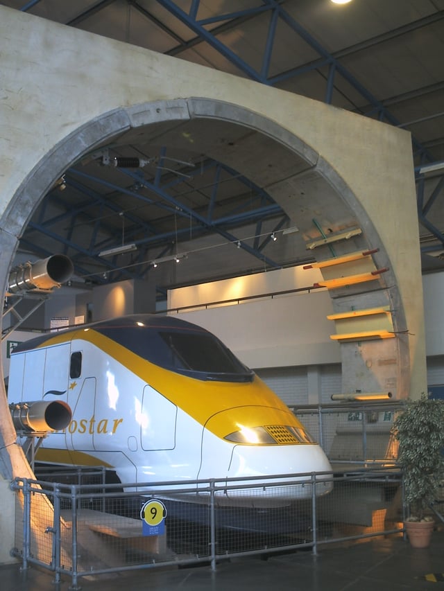 The Channel Tunnel exhibit at the National Railway Museum in York, England, showing the circular cross section of the tunnel with the overhead line powering a Eurostar train. Also visible is the segmented tunnel lining