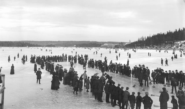 Group of people curling on a lake in Dartmouth, Nova Scotia, Canada, c. 1897