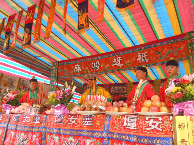 Folk ritual masters conducting a ceremony.