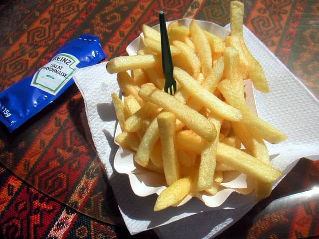 Pommes frites with a mayonnaise packet