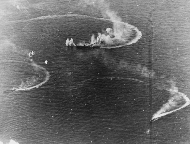 The Japanese aircraft carrier Zuikaku and two destroyers under attack in the Battle of the Philippine Sea