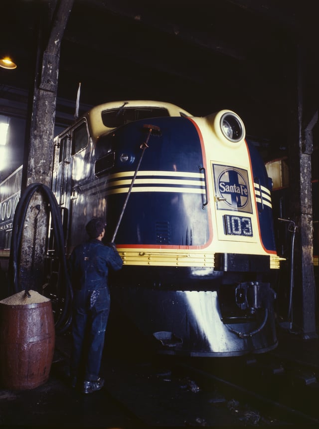 Santa Fe #103, an EMD FT unit decorated in the "Cat Whiskers" scheme, receives service during World War II