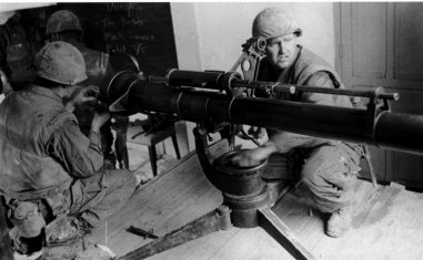 U.S. Marines deploy a 106 mm recoilless rifle from within Huế University to target a PAVN machine gun emplacement