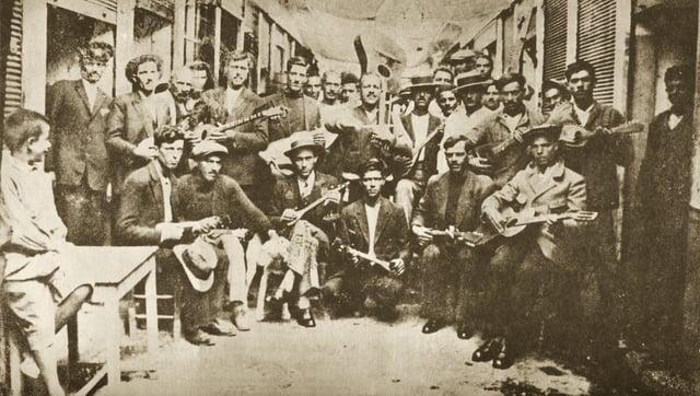 Rebetes in Karaiskaki, Piraeus (1933). Left Markos Vamvakaris with bouzouki.