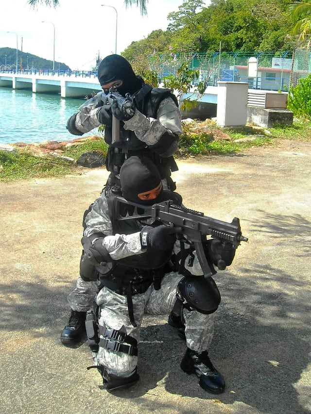 Malaysian Maritime Enforcement Agency officers armed with the UMP9 and SG 553.