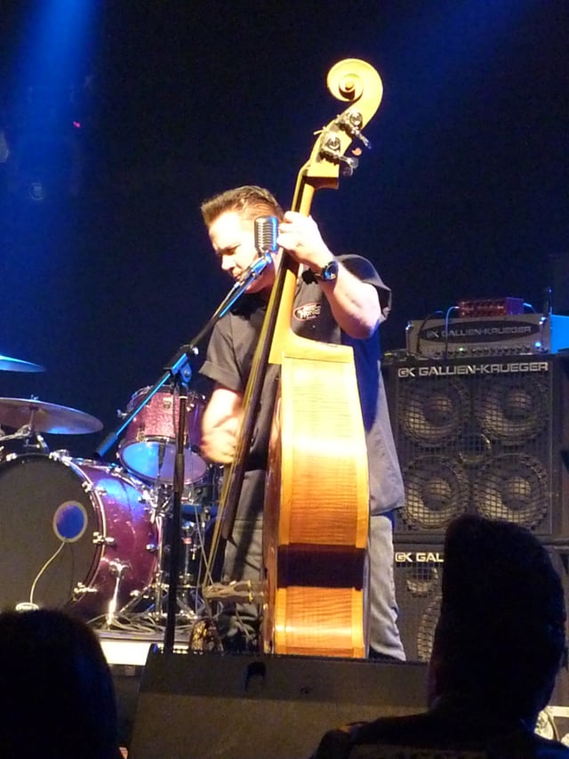 Psychobilly bassist Jimbo Wallace onstage with Reverend Horton Heat; note his large bass stack consisting of a 1x15" cabinet, a 4x10" cabinet, and an amplifier "head".
