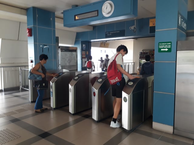 Fare gates at Compassvale LRT station.