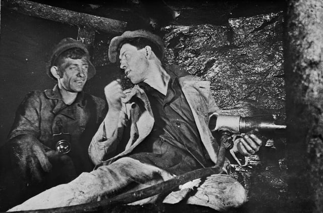 Aleksei Grigorievich Stakhanov with a fellow miner; Stalin's government initiated the Stakhanovite movement to encourage hard work. It was partly responsible for a substantial rise in production during the 1930s.
