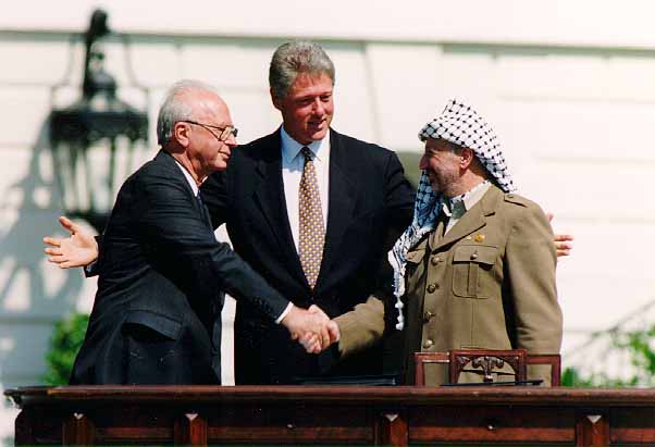 Yitzhak Rabin, Bill Clinton, and Yasser Arafat at the Oslo Accords signing ceremony on 13 September 1993