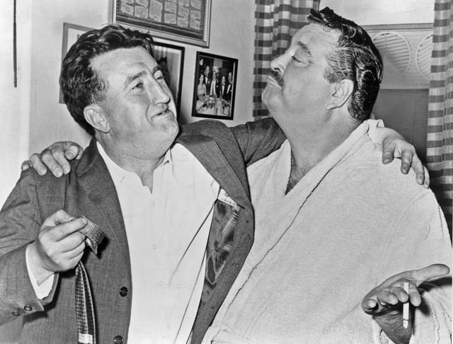 Prominent Irish writer Brendan Behan with Jackie Gleason in Gleason's dressing room after a performance of Take Me Along (1960)