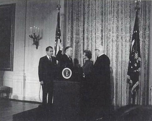 Romney was sworn in as Secretary of Housing and Urban Development on January 22, 1969, with President Richard Nixon and wife Lenore Romney at his side.