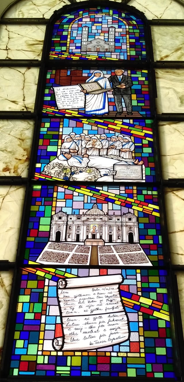 Stained glass depiction of key moments in the lifetime of Mother Teresa at the Cathedral of Saint Mother Teresa in Prishtinë, Kosovo