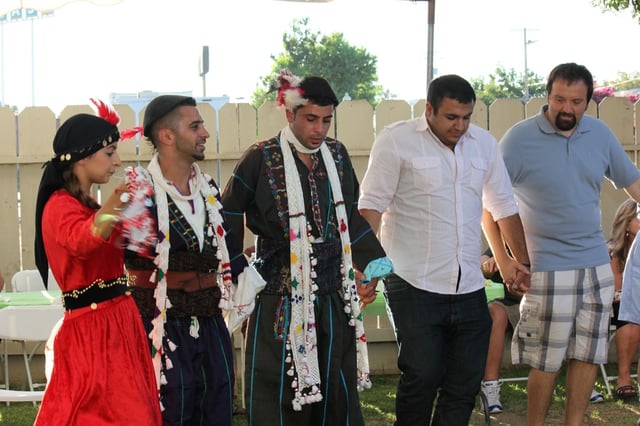 Traditional clothing may be worn for Assyrian folk dance.