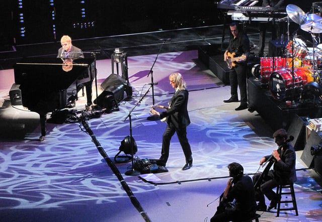 The Elton John Band performing on 15 March 2012. Left to right: John, Johnstone, Birch, and (not pictured, right), Olsson and Cooper