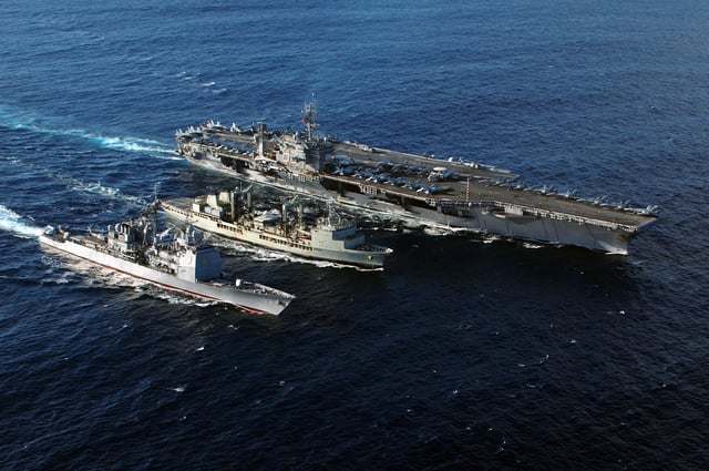 HMAS Success refuels USS Kitty Hawk and USS Cowpens.