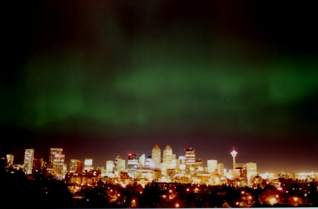 Aurora beyond Calgary's downtown skyline