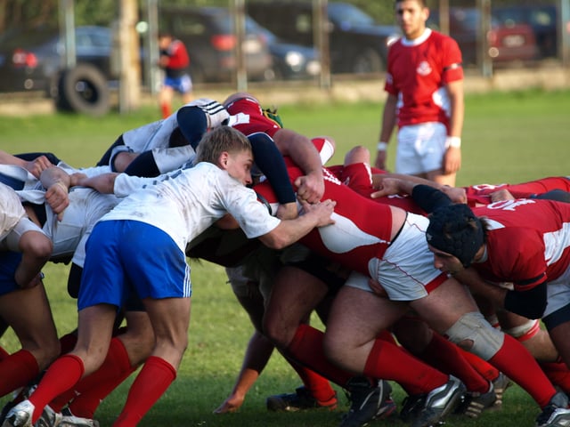 Opposing props attempt to gain the upper hand in the scrum.