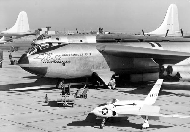 XB-52 Prototype on flight line (X-4 in foreground). Note original tandem-seat "bubble" style canopy, similar to Boeing's earlier B-47 Stratojet.
