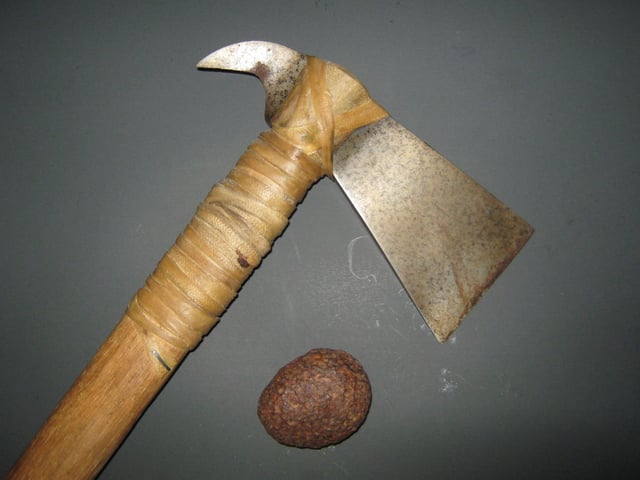 A meteorite and a hatchet that was forged from meteoric iron.