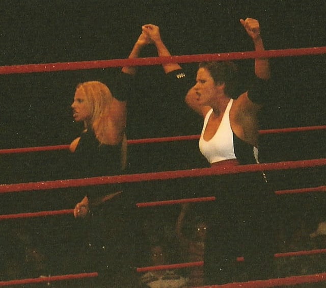 Stratus (left) along with Molly Holly during a WWE house show in October 2004