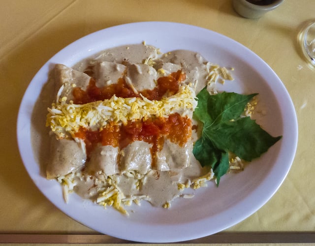 Papadzules, a Maya meal consisting of pumpkin seed-soaked corn tortillas filled with egg, spices and other seasonings, is an ancient dish of the Yucatán.
