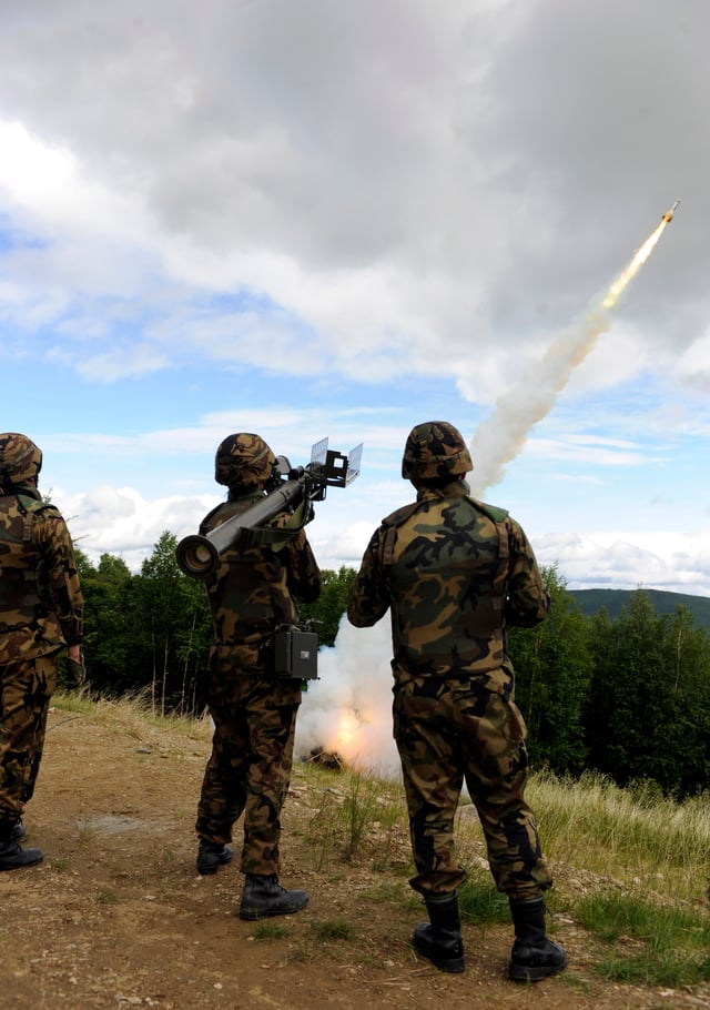 A three-person JASDF fireteam fires a missile from a Type 91 Kai MANPAD during an exercise at Eielson Air Force Base, Alaska as part of Red Flag – Alaska.