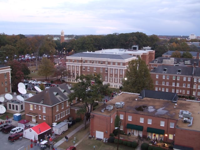 A view of some campus buildings during seasonal tailgating, 2008. Denny Chimes visible in the background