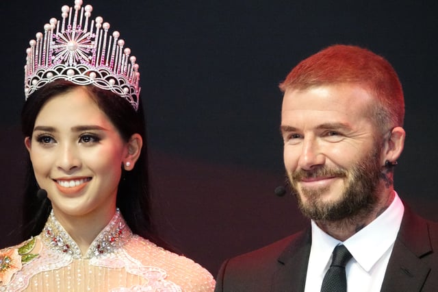 Beckham with Miss Vietnam at the Paris Motor Show 2018