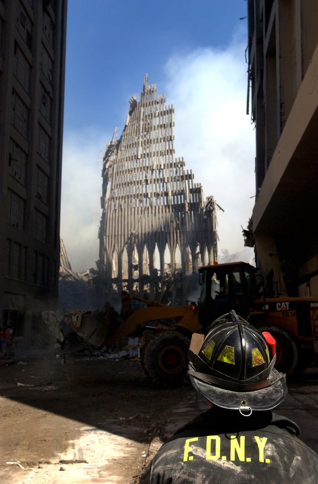 A fireman looks up at the remains of the South Tower.