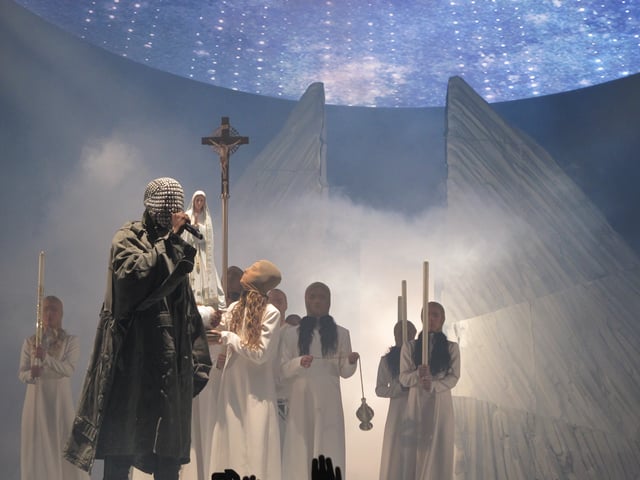 West performing on the Yeezus Tour in 2013.
