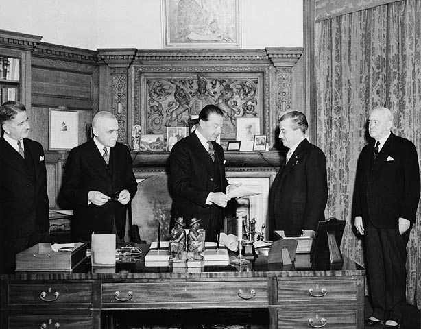 At Rideau Hall, Governor General the Viscount Alexander of Tunis (centre) receives the bill finalizing the union of Newfoundland and Canada on March 31, 1949.
