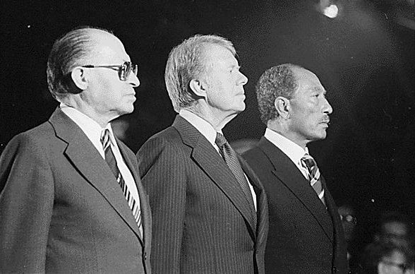 Celebrating the signing of the 1978 Camp David Accords: Menachem Begin, Jimmy Carter, Anwar Sadat