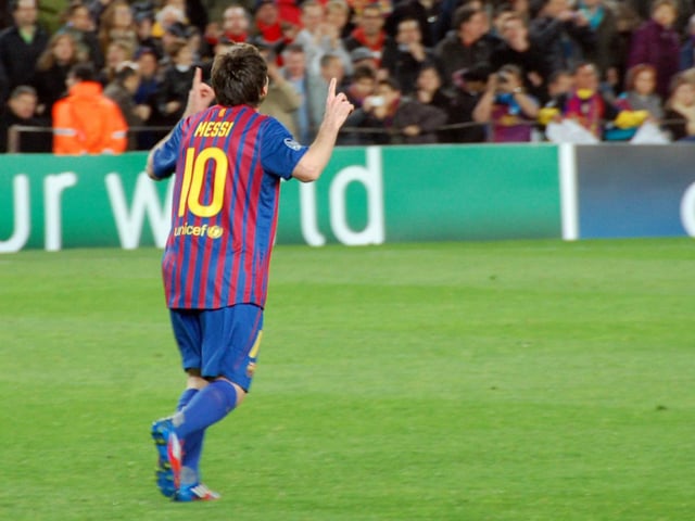 Messi pointing to the sky following his record five-goal display against Bayer Leverkusen in the last 16 of the UEFA Champions League in March 2012