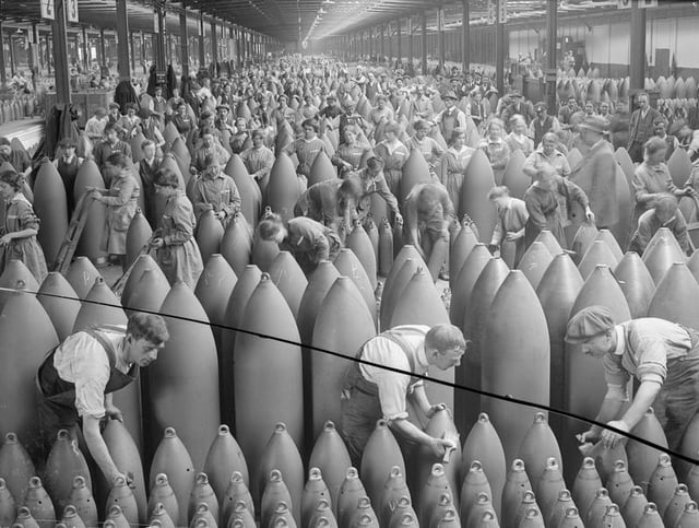Painting shells in a shell filling factory during World War I.