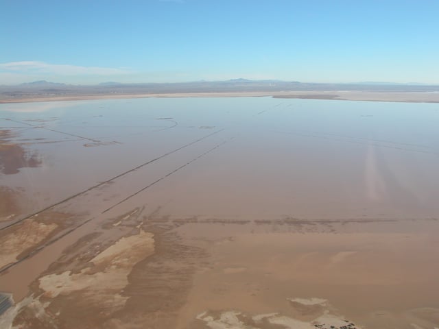 The Rogers Lake is not always dry. During the brief rainy season in the Mojave Desert, water fills the lake bed. The compass rose can be seen on the left.