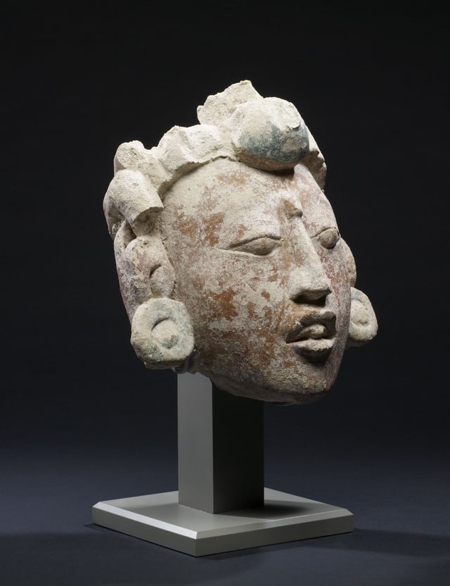 Stucco head of the Maya maize god, 550–850 AD.