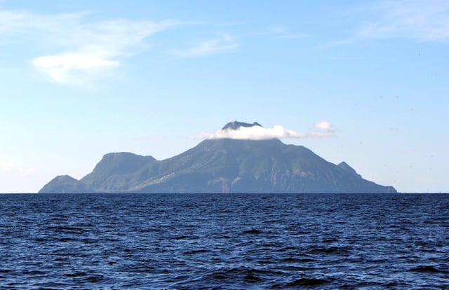Saba island as viewed from the north, with Mount Scenery's peak in the clouds