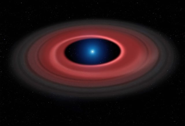 Artist's impression shows how an asteroid is torn apart by the strong gravity of a white dwarf.