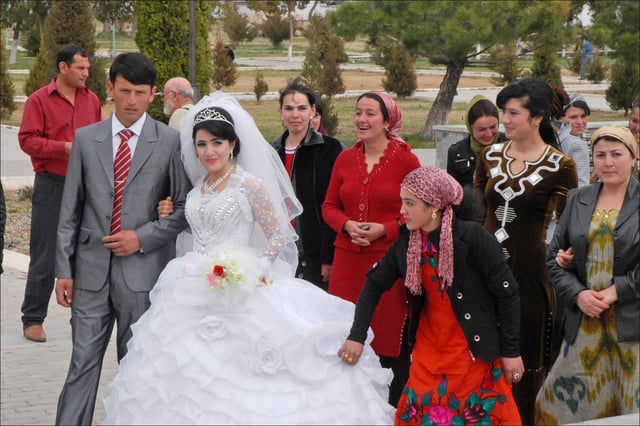 Newlywed couples visit Tamerlane's statues to receive wedding blessings.