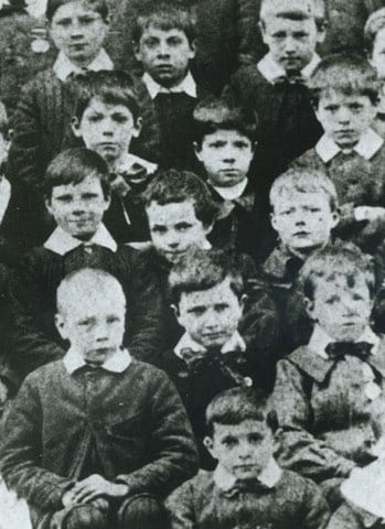 Seven-year-old Chaplin (middle centre, leaning slightly) at the Central London District School for paupers, 1897