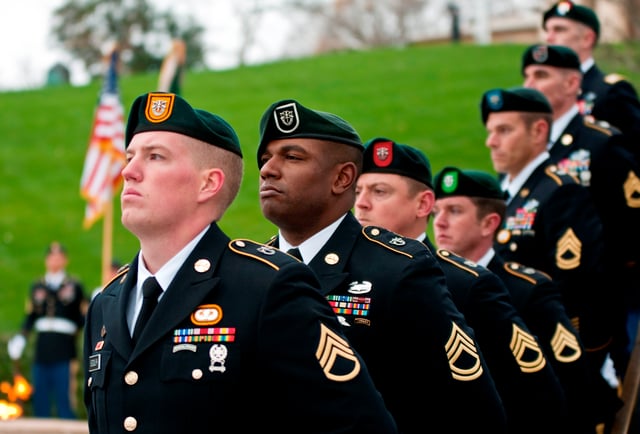 Soldiers from each of the Army's seven Special Forces groups (note seven different colors of beret patches) at the gravesite of President John F. Kennedy in November 2011.