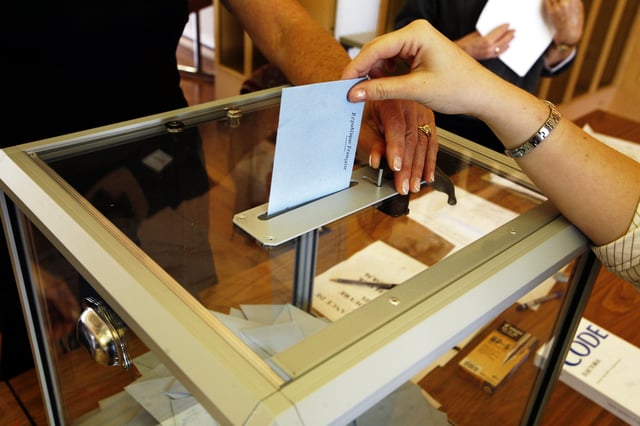 A person casts vote in the second round of the 2007 French presidential election.