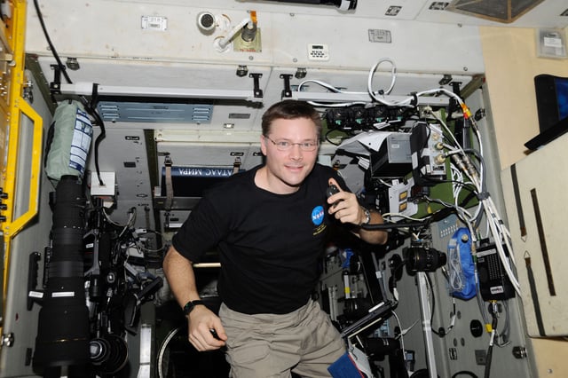 NASA astronaut Col. Doug Wheelock, KF5BOC, Expedition 24 flight engineer, operates the NA1SS ham radio station in the Zvezda Service Module of the International Space Station. Equipment is a Kenwood TM-D700E transceiver.